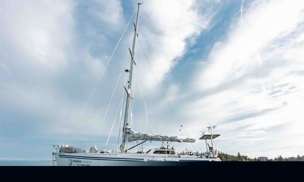 A sailboat named "The American Promise" sits on the water in the Gulf of Maine..