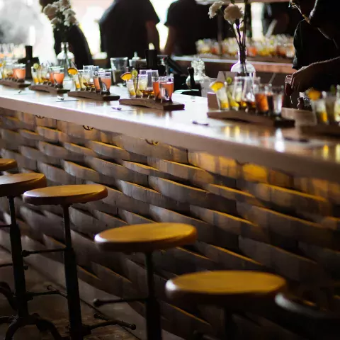 Image shows a bar with whiskey tasting flights